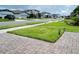 Well maintained suburban street with manicured lawns and sidewalks in a peaceful neighborhood at 2824 Neverland Dr, New Smyrna Beach, FL 32168