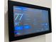 AprilAire thermostat displaying indoor and outdoor temperatures with climate control settings at 2824 Neverland Dr, New Smyrna Beach, FL 32168