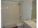 Bright bathroom with tub and shower combination and modern vanity at 2864 N Powers Drive # 156, Orlando, FL 32818