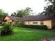 Community clubhouse with well-maintained landscaping, windows, and ample parking at 2864 N Powers Drive # 156, Orlando, FL 32818
