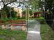 Community recreation area featuring a bocce court and benches, perfect for outdoor enjoyment at 2864 N Powers Drive # 156, Orlando, FL 32818