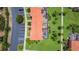 Aerial perspective of colorful condos showing backyard, palm trees, and covered patio at 3010 Secret Lake Dr, Kissimmee, FL 34747