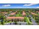 Scenic aerial shot of townhomes with lush landscaping, colorful exteriors, and community parking at 3010 Secret Lake Dr, Kissimmee, FL 34747