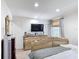 Bright bedroom with a decorative bed, TV, and window at 3010 Secret Lake Dr, Kissimmee, FL 34747