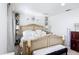 Bright bedroom featuring a decorative lamps, bed, and furnishings at 3010 Secret Lake Dr, Kissimmee, FL 34747