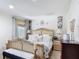 Spacious bedroom with decorative lamps, bed, and furnishings at 3010 Secret Lake Dr, Kissimmee, FL 34747