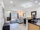 Open-concept space with modern furnishings and a sliding glass door to the patio at 3010 Secret Lake Dr, Kissimmee, FL 34747