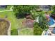 Aerial view of colorful playground, swings, and recreational area next to the lake at 3010 Secret Lake Dr, Kissimmee, FL 34747
