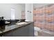 Modern bathroom with granite counters, neutral shower curtain, and updated fixtures at 3308 Tranquil Trl, Kissimmee, FL 34747