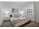 Calm bedroom with a bed, side tables and lamps at 3308 Tranquil Trl, Kissimmee, FL 34747