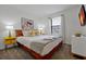 A cozy bedroom features bright decor, a large bed, and stylish furniture at 3308 Tranquil Trl, Kissimmee, FL 34747