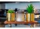 Close up of a decorative candle with two small succulents on a granite countertop at 3308 Tranquil Trl, Kissimmee, FL 34747