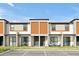Modern townhome features neutral tones, complementary accents, and a comfortable patio space at 3308 Tranquil Trl, Kissimmee, FL 34747