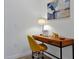 Comfortable home office featuring wood desk and stylish yellow chair at 3308 Tranquil Trl, Kissimmee, FL 34747