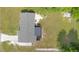 Aerial view of home showing roof, driveway, and spacious grassy yard at 36 Morning Glory Dr, Debary, FL 32713