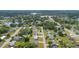 Aerial view of neighborhood with well-maintained homes, mature trees and small lakes at 36 Morning Glory Dr, Debary, FL 32713