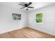 Bedroom with wood-look floors and windows providing lots of natural light at 36 Morning Glory Dr, Debary, FL 32713