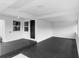 The spacious modern porch features a dark door and smooth concrete flooring at 36 Morning Glory Dr, Debary, FL 32713