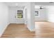 Bright living room showcasing hardwood floors, fresh paint, and natural light through windows at 36 Morning Glory Dr, Debary, FL 32713