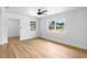 Bright room with hardwood floors, ceiling fan, two large windows offering ample natural light and crisp white walls at 36 Morning Glory Dr, Debary, FL 32713
