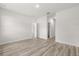 Spacious bedroom features modern flooring and open doorways to ensuite spaces at 4345 Sw 143Rd Lane Rd, Ocala, FL 34473