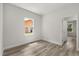 Bedroom featuring wood-look flooring and a window offering natural light at 4345 Sw 143Rd Lane Rd, Ocala, FL 34473
