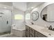 Bright bathroom featuring dual sinks, soaking tub, and separate glass enclosed shower at 462 Lakepark Trl, Oviedo, FL 32765