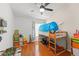 Cozy bedroom with wood floors, ceiling fan and playful furnishings including a bunk bed at 462 Lakepark Trl, Oviedo, FL 32765