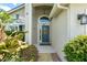 Inviting front entrance with a decorative glass door and tiled entryway at 462 Lakepark Trl, Oviedo, FL 32765