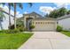 Charming single-Gathering home featuring a two-car garage and well-manicured landscaping at 462 Lakepark Trl, Oviedo, FL 32765