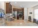 Well-equipped kitchen featuring stainless steel appliances and beautiful granite countertops at 462 Lakepark Trl, Oviedo, FL 32765