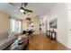 Bright living space featuring tile floors, comfortable seating, and access to the dining area at 462 Lakepark Trl, Oviedo, FL 32765