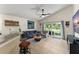Stylish living room featuring a sliding glass door to the patio at 462 Lakepark Trl, Oviedo, FL 32765