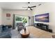 Bright living room featuring a sliding glass door to the patio at 462 Lakepark Trl, Oviedo, FL 32765