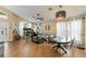 Open-concept living and dining area featuring tile flooring, modern lighting, and comfortable seating at 462 Lakepark Trl, Oviedo, FL 32765