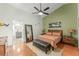 Inviting main bedroom with a large mirror and ensuite bathroom entrance at 462 Lakepark Trl, Oviedo, FL 32765