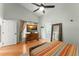 Comfortable main bedroom with a TV and ensuite bathroom entrance at 462 Lakepark Trl, Oviedo, FL 32765