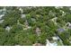 Aerial view of home nestled among lush trees in a tranquil neighborhood at 4702 Shorecrest Dr, Orlando, FL 32817
