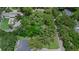 Aerial view of lot with mature trees, showcasing a private and wooded setting at 4702 Shorecrest Dr, Orlando, FL 32817