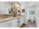 Bright bathroom featuring a double sink vanity, decorative mirrors, and a shower with curtain at 4702 Shorecrest Dr, Orlando, FL 32817