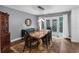 Elegant dining room with modern lighting, wood floors, and stylish decor at 4702 Shorecrest Dr, Orlando, FL 32817