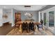 Dining room with decorative rug, french doors to outside, and stylish furnishings at 4702 Shorecrest Dr, Orlando, FL 32817