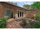 Cozy front courtyard featuring brick pavers, a quaint bench, and access to the home at 4702 Shorecrest Dr, Orlando, FL 32817