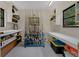 Spacious garage contains multiple wall mounted shelves and a stand for storing fishing poles at 4702 Shorecrest Dr, Orlando, FL 32817