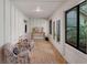 Sunroom hallway with exposed brick floors at 4702 Shorecrest Dr, Orlando, FL 32817