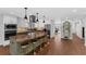 Spacious kitchen with updated island, stainless appliances, tile backsplash, and pendant lighting at 4702 Shorecrest Dr, Orlando, FL 32817