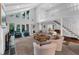 Bright living room with vaulted ceilings, a fireplace, and doors to the outside at 4702 Shorecrest Dr, Orlando, FL 32817
