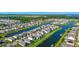 Beautiful aerial view of waterfront homes in a Primary-planned community surrounded by lush landscaping and waterways at 4908 Lotta Ct, St Cloud, FL 34772