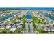 An aerial view showcases a community pool, clubhouse, and manicured landscaping in a neighborhood at 4908 Lotta Ct, St Cloud, FL 34772