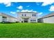 Large backyard showcasing lush lawn, perfect for recreation, and a covered patio at 4908 Lotta Ct, St Cloud, FL 34772